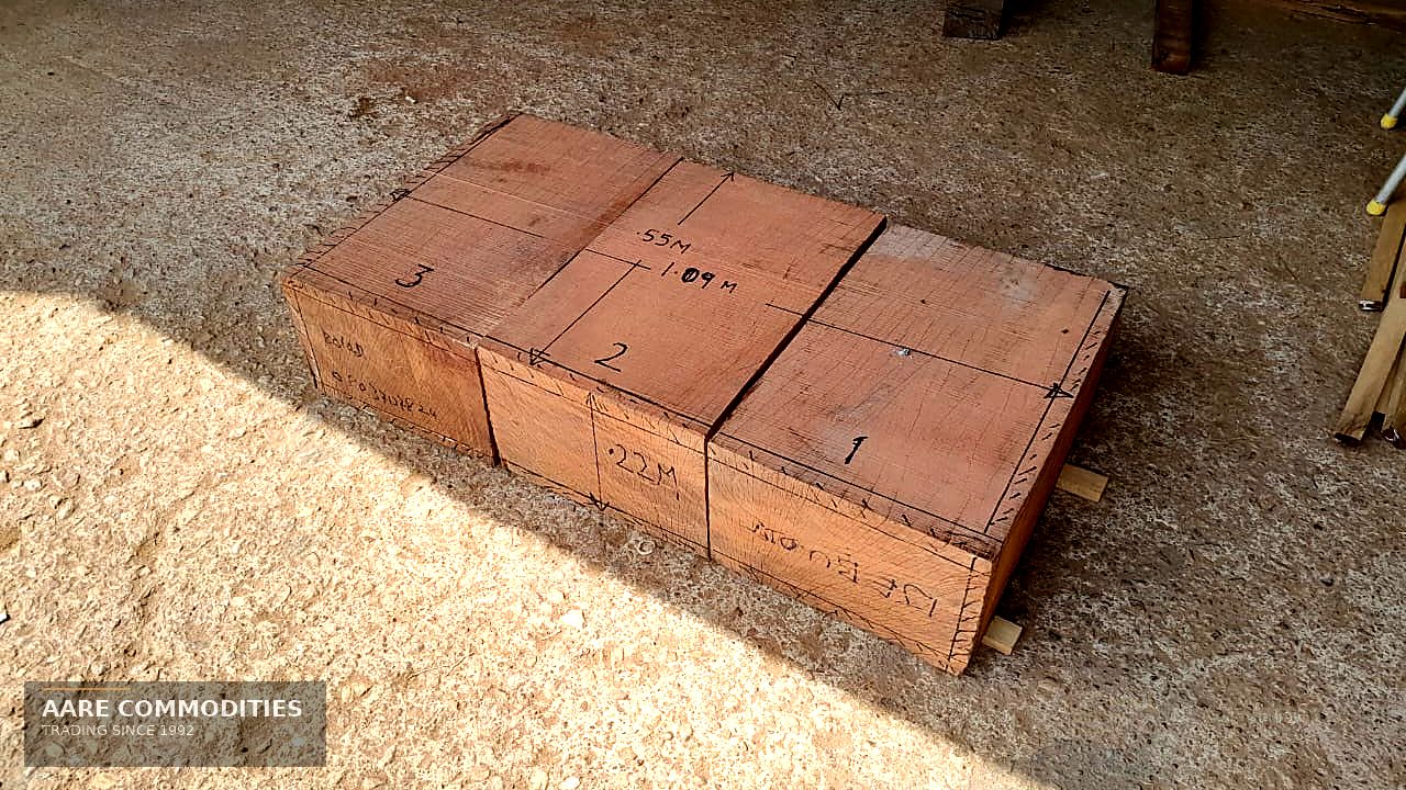 Squared Ekki / Azobé hardwood baulks, hand-marked with piece dimensions, stacked at the AARE Commodities yard in Nigeria